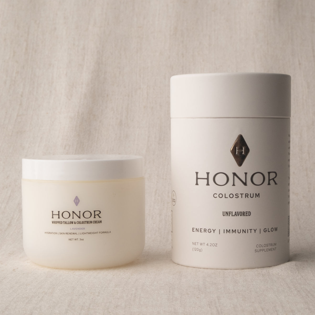 Honor Colostrum tube beside the Whipped Tallow & Colostrum Cream jar